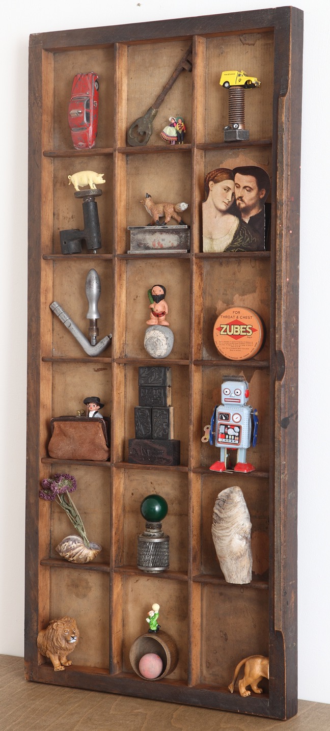 Wall art display of small items juxtapositionsed in an antique printers type case drawer originally used for larger wood printing blocks. Made by the famous cabinet makers Stephenson Blake of Sheffield & London 