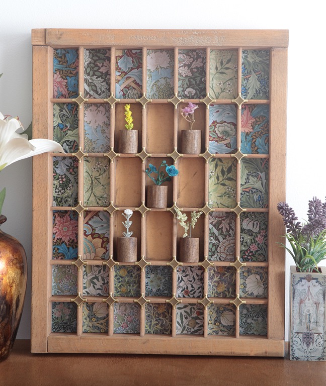Decorative little display of William Morris prints and little wooden vases in vintage letterpress printers drawer tray type case