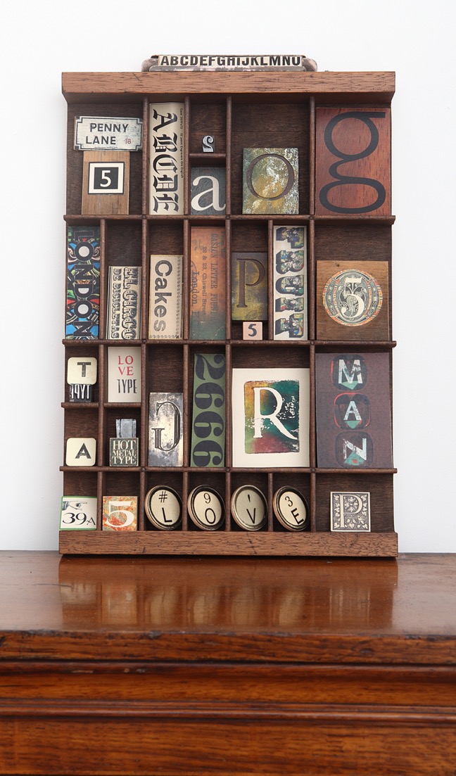 quirky typography themed artwork in old printers tray