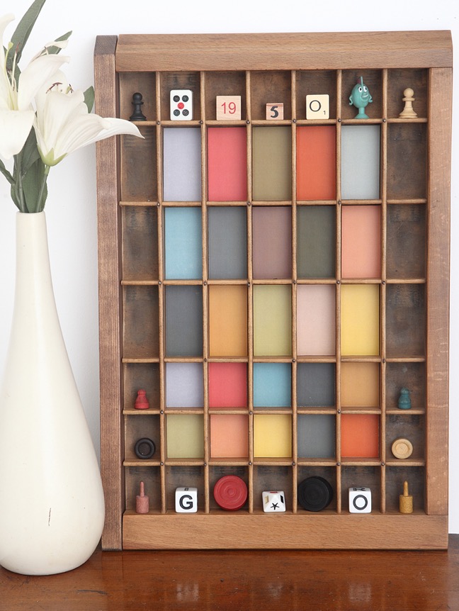 Vintage letterpress printers tray with muted mid century colours