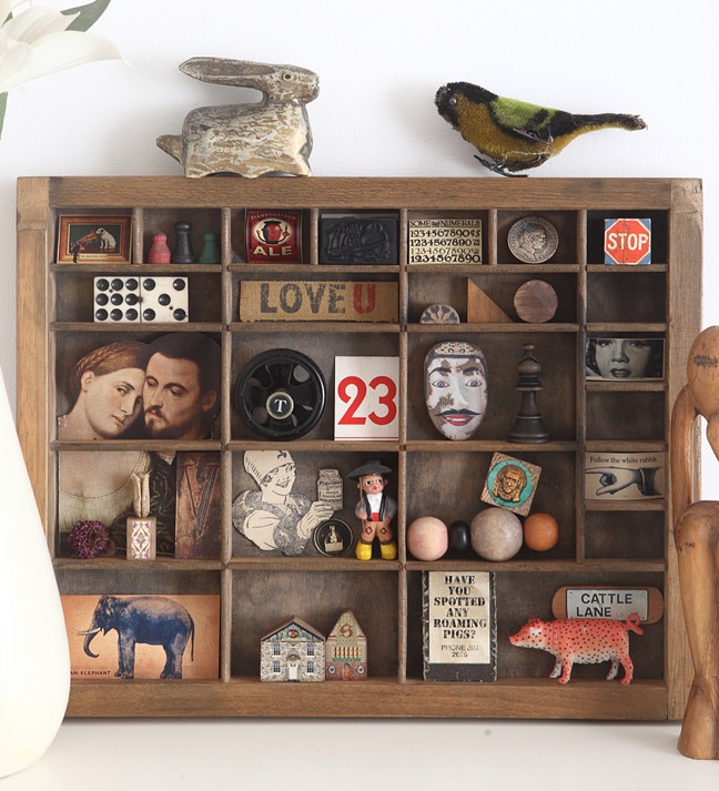 vintage printers tray re purposed as a display for an eclectic mix of vintage items
