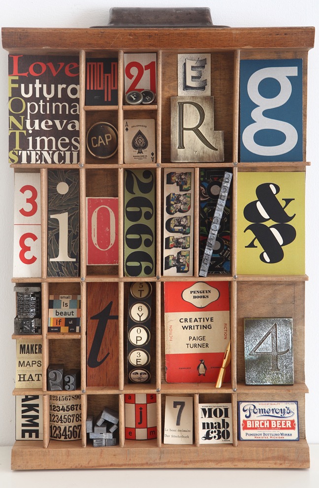 Typography themed artwork in an old letterpress printers type case