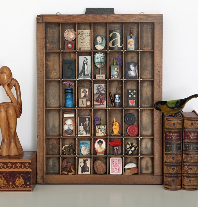 Antique printers type case drawer filled with vintage curios and handmade quirky items